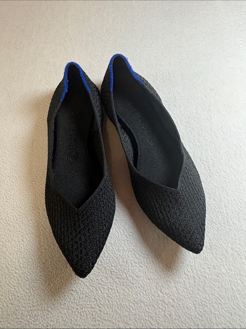 Rothy's Black Pointed Knit Flats with Blue Heel Accent